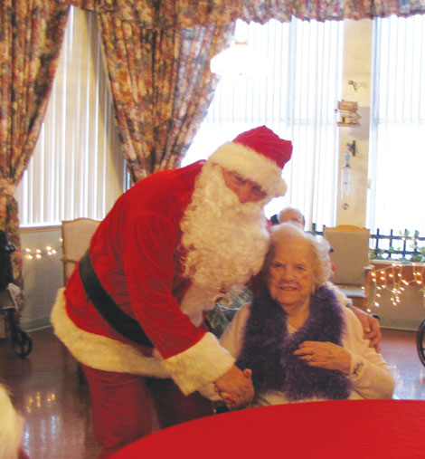 Bill Looney brightened the lives of seniors by dressing as Santa Claus and visiting them in nursing homes. 