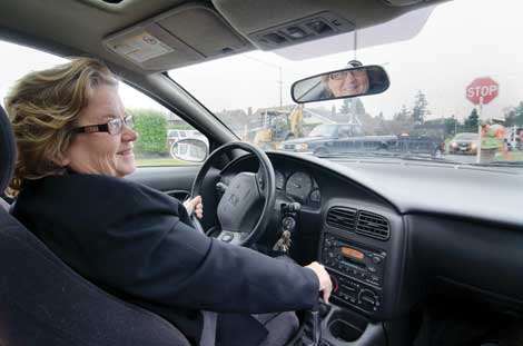 Juli McGruder, a professor emerita at University of Puget Sound, sat at the wheel of a â€œfittedâ€ car during the schoolâ€™s CarFit event in 2011. (Courtesy photo) 