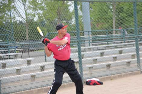Seventy-seven-year-old Jim Douglas, who teammates call "Crusher," warms up before a recent softball game at Celebration Park in Federal Way. (Joan Cronk/Senior Scene)