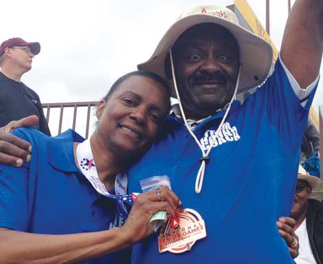 Madonna Hanna celebrates at the National Senior Games with her husband and coach, J. Steven Hanna.