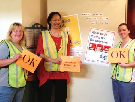 Staff members Leslie Jo Thompson, Maringi Lloyd and Amanda Boysen, members of the safety committee at Bridgeport Place, helped organize an earthquake drill for the Great Shakeout event. (Courtesy photo) 