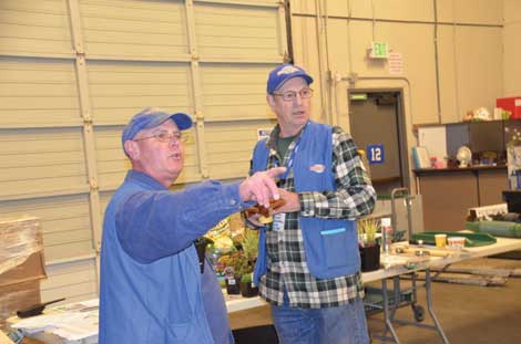 Joe Freeman and Ron Linck of the McLendon Hardware store in Tacoma addressed customers at a recent workshop on rain gardens and water retention for homeowners. (Joan Cronk/Senior Scene)