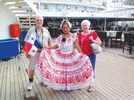 Pete and Rose Neff joined a Panamian dancer on deck as the Norwegian Sun passes through the Panama Canal.
