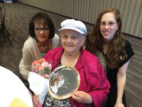 Pat Sparrow, holding her Silver Plate award from Kitsap Meals on Wheels, with Donna Jones (left) of Catholic Community Services and Julie Kerrigan of Lutheran Community Services Northwest.