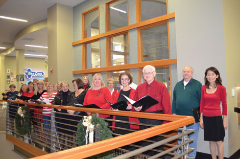 The Tapestry Singers get ready to perform holiday songs at the Puyallup Public Library. (Joan Cronk/for Senior S)cene 