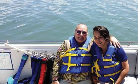 Linda Groshart (left), seated in the boat that took her parasailing, shares a moment with Vanessa Gutierrez, the enrichment coordinator at Point Defiance Village, where Groshart lives when she isnâ€™t out pursuing her â€œbucket list.â€