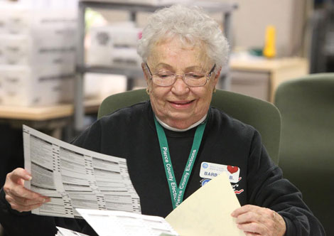One of the 450 temporary election workers in Pierce County who helped sort mailed-in ballots at the county elections center. (Jim Bryant/for Senior Scene)